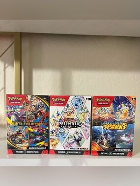 3pc Pokemon Booster Bundles Prismatic Evolutions, Mega Evolutions,Surging Sparks